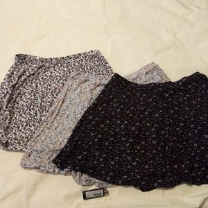 Bundle of three floral wet seal skater skirts